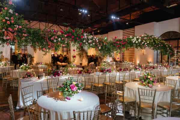 Elegant event space at The Revaire, ideal for weddings with lush floral arrangements.
