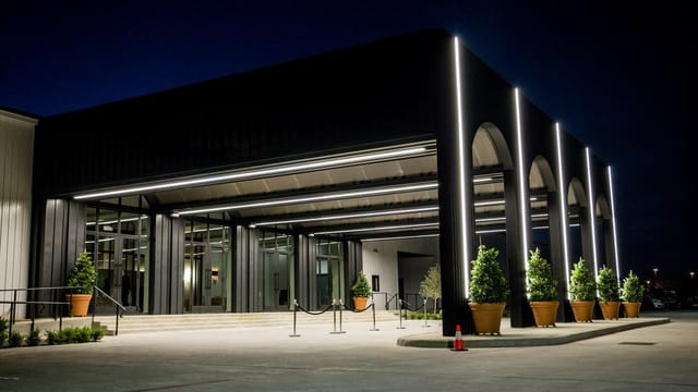 Modern venue entrance with sleek lines and warm lighting for upscale events.