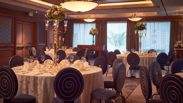 Elegant Nautilus Ballroom with round tables, perfect for weddings and corporate events.
