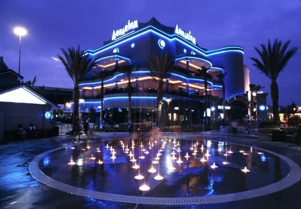 Downtown Aquarium outdoor venue with blue lighting, perfect for events and ceremonies.
