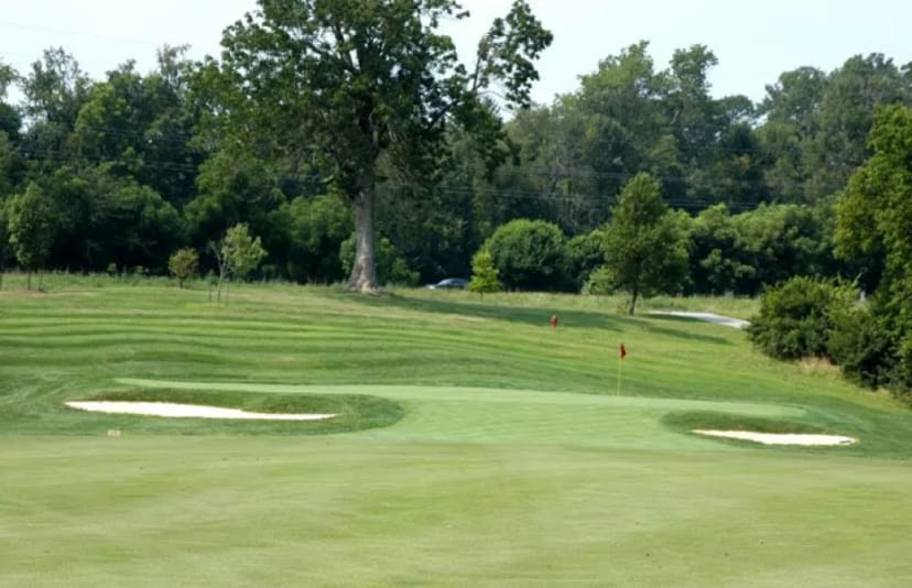 Lush Houston Oaks Golf Course with sand traps for corporate outings and team-building events.