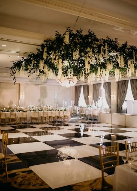 Elegant ballroom at The Houstonian Hotel with lush florals, perfect for weddings and events.