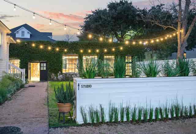 Charming outdoor venue with string lights for events and gatherings at Heights Ironworks.