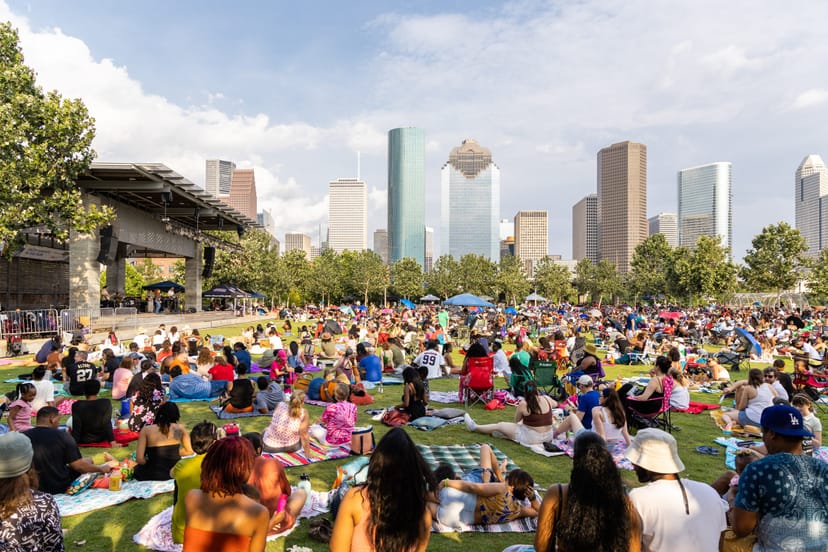 Curtain Call event in Buffalo Bayou Park with a vibrant crowd and urban skyline.