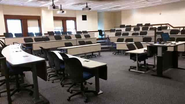 Flexible classroom space at Rice University with tiered seating for workshops and training.