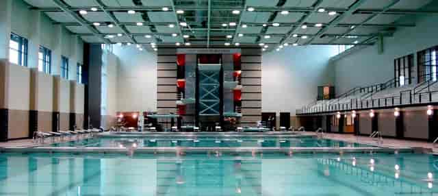 Spacious indoor pool area for aquatic events and networking at Recreation & Wellness Center.