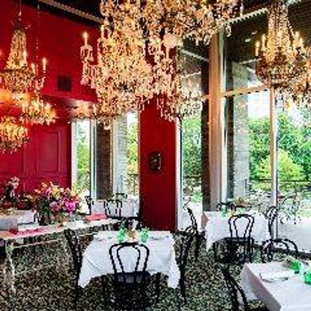 Elegant dining space with chandeliers, ideal for upscale events and gatherings.