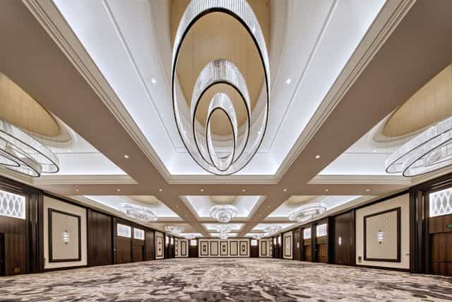 Grand Ballroom at The Post Oak Hotel with modern chandeliers, perfect for weddings and conferences.