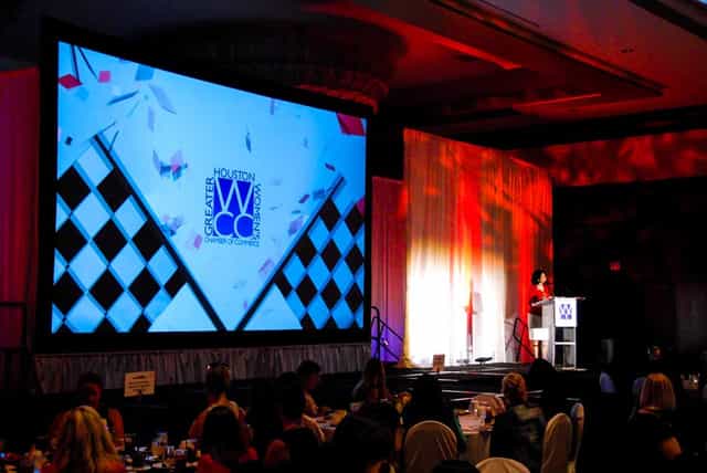 Elegant event hall with stage set for awards ceremony in Greater Houston.