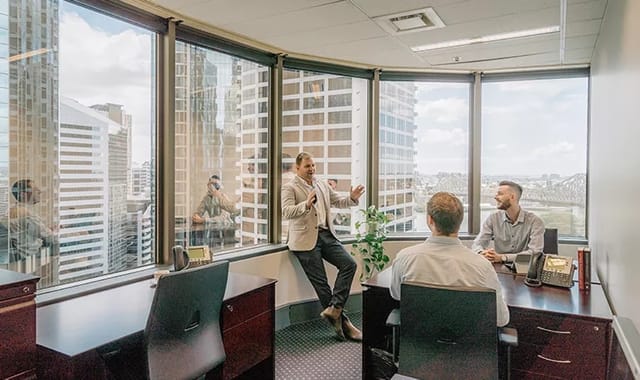Modern meeting space with large windows, ideal for client meetings and brainstorming sessions.
