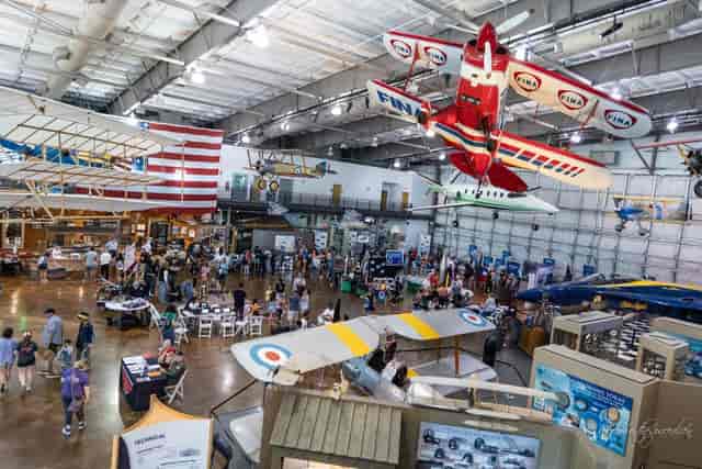 Vibrant Main Exhibit Hall at Frontiers of Flight Museum for networking events and conferences.