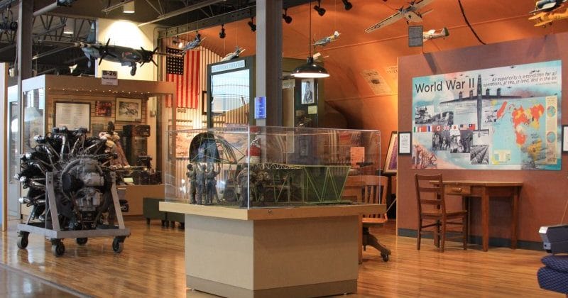 Conference room in Frontiers of Flight Museum, featuring aviation exhibits for networking events.