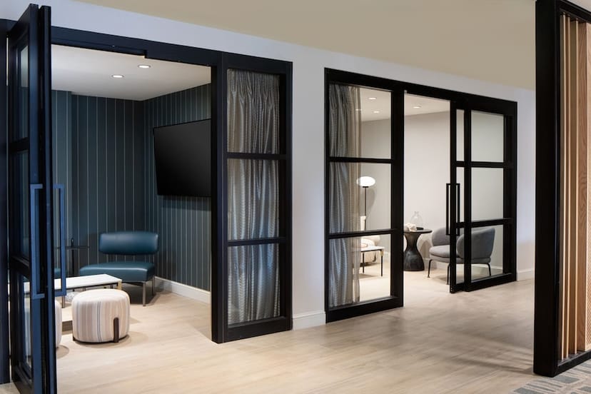 Modern meeting space at Sheraton Fort Worth with glass partitions for productive events.