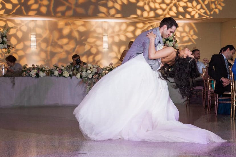 Intimate wedding dance in Grand Hall, Texas Discovery Gardens, with soft lighting.