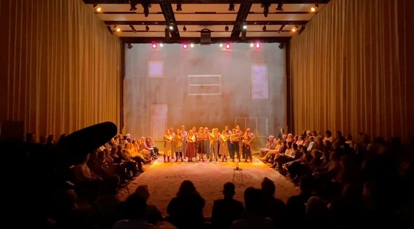 Hamon Hall, circular seating, warm lighting for immersive performances and events.