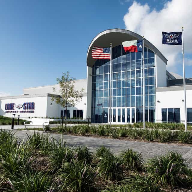Heritage Hangar at Lone Star Flight Museum, modern event venue with large glass windows.