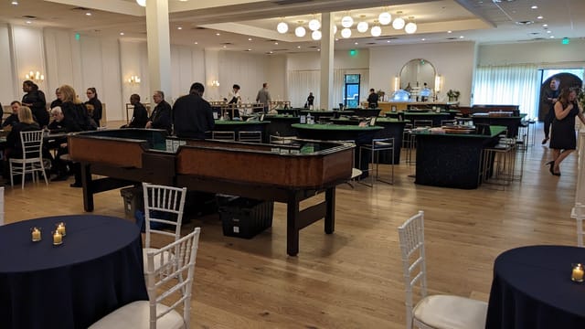 Elegant event venue in The Hall on Dragon with navy tables, perfect for gatherings.