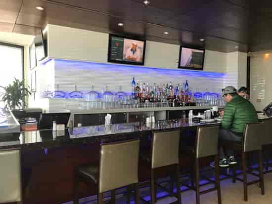 Private dining space with sleek bar for networking and events at Mi Cocina.