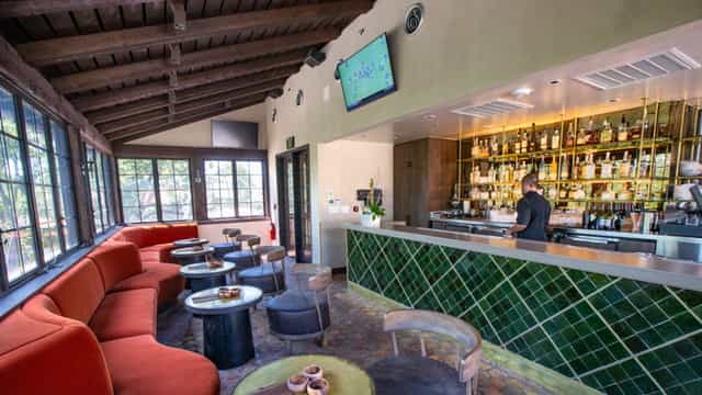 Cozy Mi Cocina bar with earthy tones, perfect for networking and cocktail receptions.