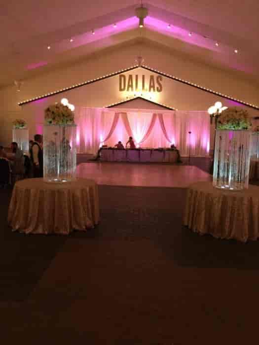 Elegant ballroom at Southfork Ranch with pink lighting, ideal for weddings and events.