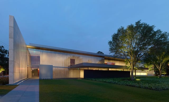 Edward Rudge Allen III Education Center, modern event venue with outdoor lawn for gatherings.