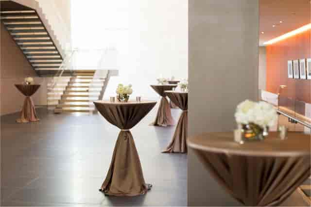 Fayez Sarofim Grand Hall at Asia Society Texas, elegant cocktail tables for corporate events.
