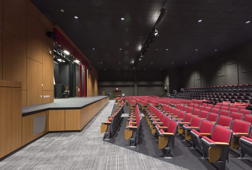 Houston ISD auditorium with tiered seating, ideal for conferences and performances.