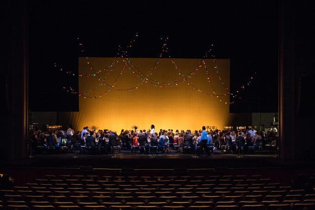 Onstage Dinner at Houston Ballet with colorful lighting and vibrant theater setup.