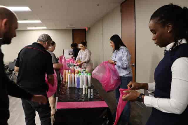 Main Hall at Houston Area Women's Center with pros preparing event materials. 