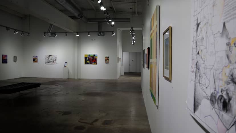 Spacious Sawyer Yards gallery with artwork, perfect for networking events and exhibitions.