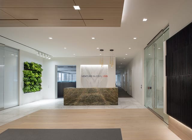 Modern reception area in Houston corporate office, ideal for networking and events.