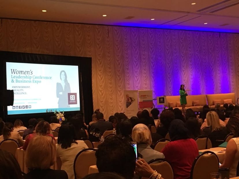 Women's Leadership Conference keynote speaker engaging diverse audience in Houston.