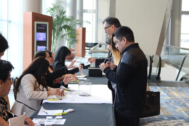 Leadership Conference registration area with attendees at Houston Hispanic Chamber of Commerce.