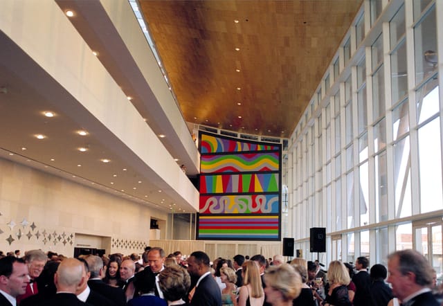 Vibrant networking event in Grand Lobby, The Hobby Center; modern space with high ceilings.