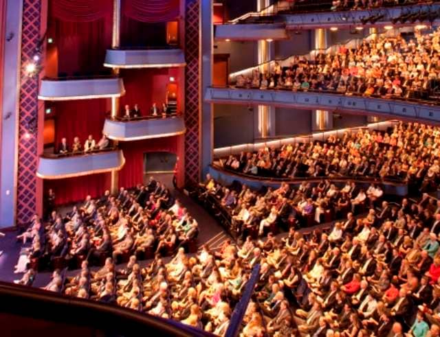 Packed theater at Hobby Center, ideal venue for performances and conferences.