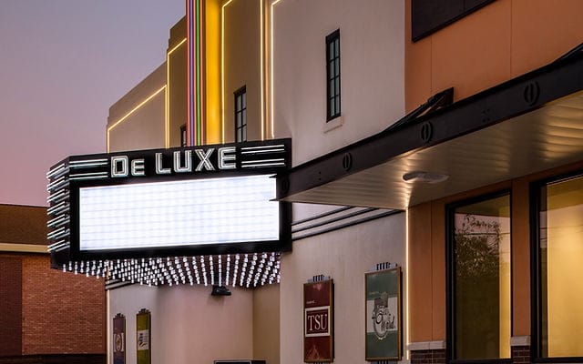 DeLUXE Theater venue with vintage marquee for film screenings and gala events, 5th Ward.
