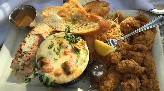 Well-plated seafood dish at Pappadeaux for upscale events, ideal for catering and networking.