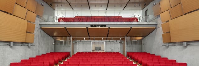 Kimbell Art Museum's Piano Auditorium with tiered red seating, ideal for events and performances.