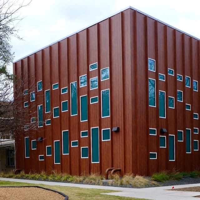 Modern classrooms with a wooden façade at First Unitarian Church of Dallas events.
