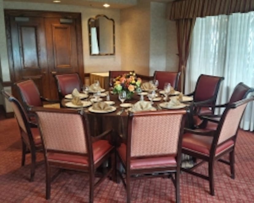 Elegant round dining table with chairs in Park City Club, ideal for meetings or gala events.