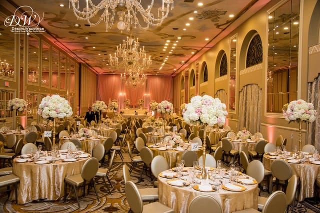 Elegant Grand Reception Ballroom with chandeliers, perfect for weddings and banquets.