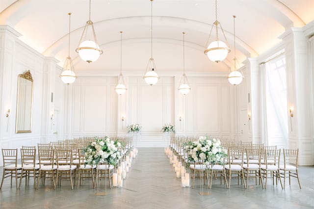 Elegant Governor's Ballroom with gold chiavari chairs for weddings and formal events.