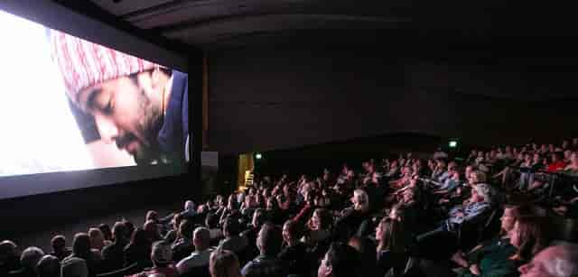 Dallas International Film Festival auditorium with captivated audience during a screening event.