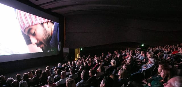 Dallas International Film Festival auditorium with captivated audience during a screening event.