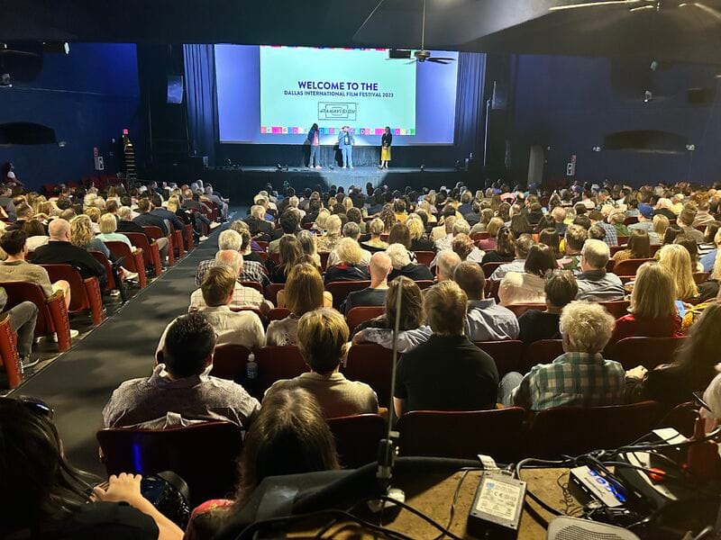 Packed auditorium at Dallas International Film Festival with engaging speakers for networking.