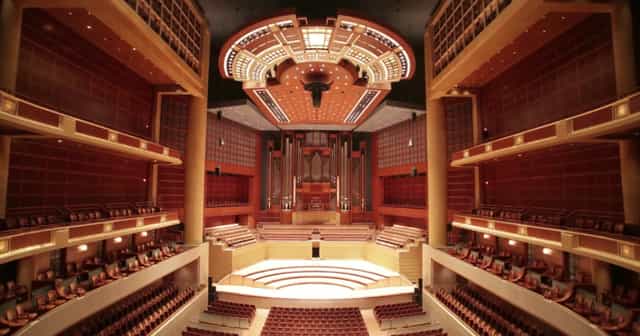 Eugene McDermott Concert Hall with dramatic lighting, ideal for concerts and conferences.