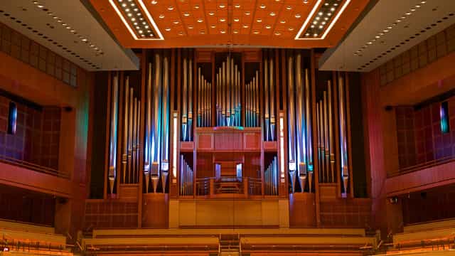 Hart Symphony Suites concert hall with grand organ, elegant acoustics for events.
