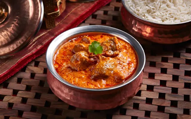 Saffron Roots curry dish with rice, perfect for catering events and local cuisine.