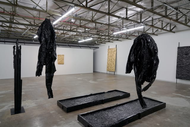 Abstract dark sculptures in Dallas Contemporary for artistic events and gatherings.
