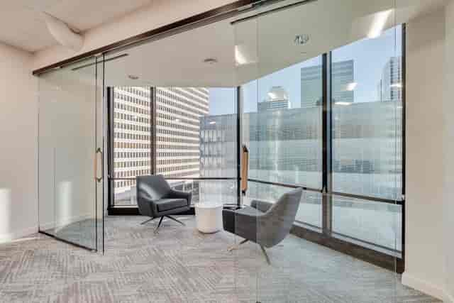 Modern board room with glass walls for meetings and brainstorming sessions in Trammell Crow Center.